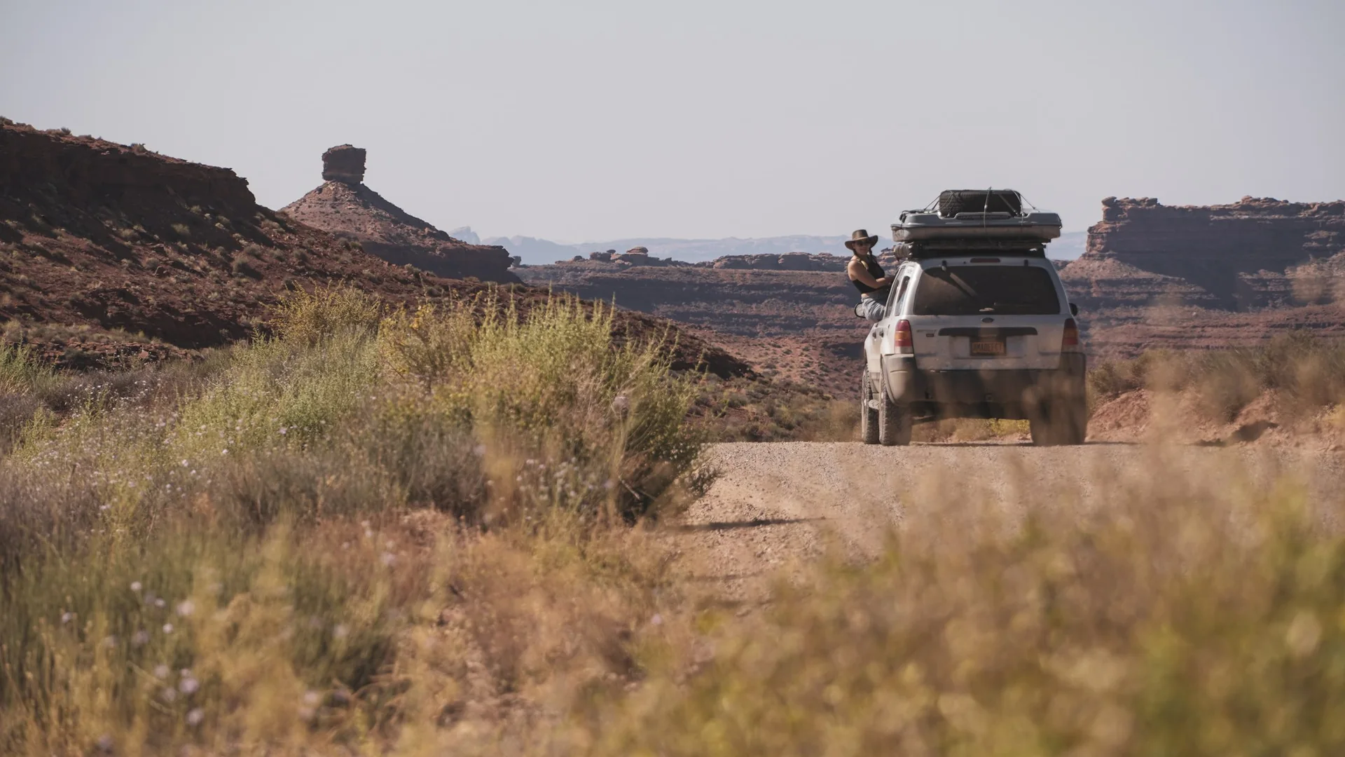 Our Ford Escape on a dirt track through the Valley of the Gods, Utah